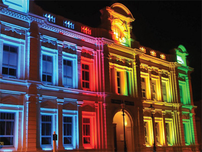 Night view of the Courthouse building lit with multi-colored lights