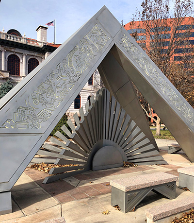 This large triangular sculpture casts changing shadows throughout the day.