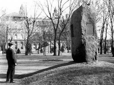 Man views the large stone monument to Zebulon Pike in this historic photo