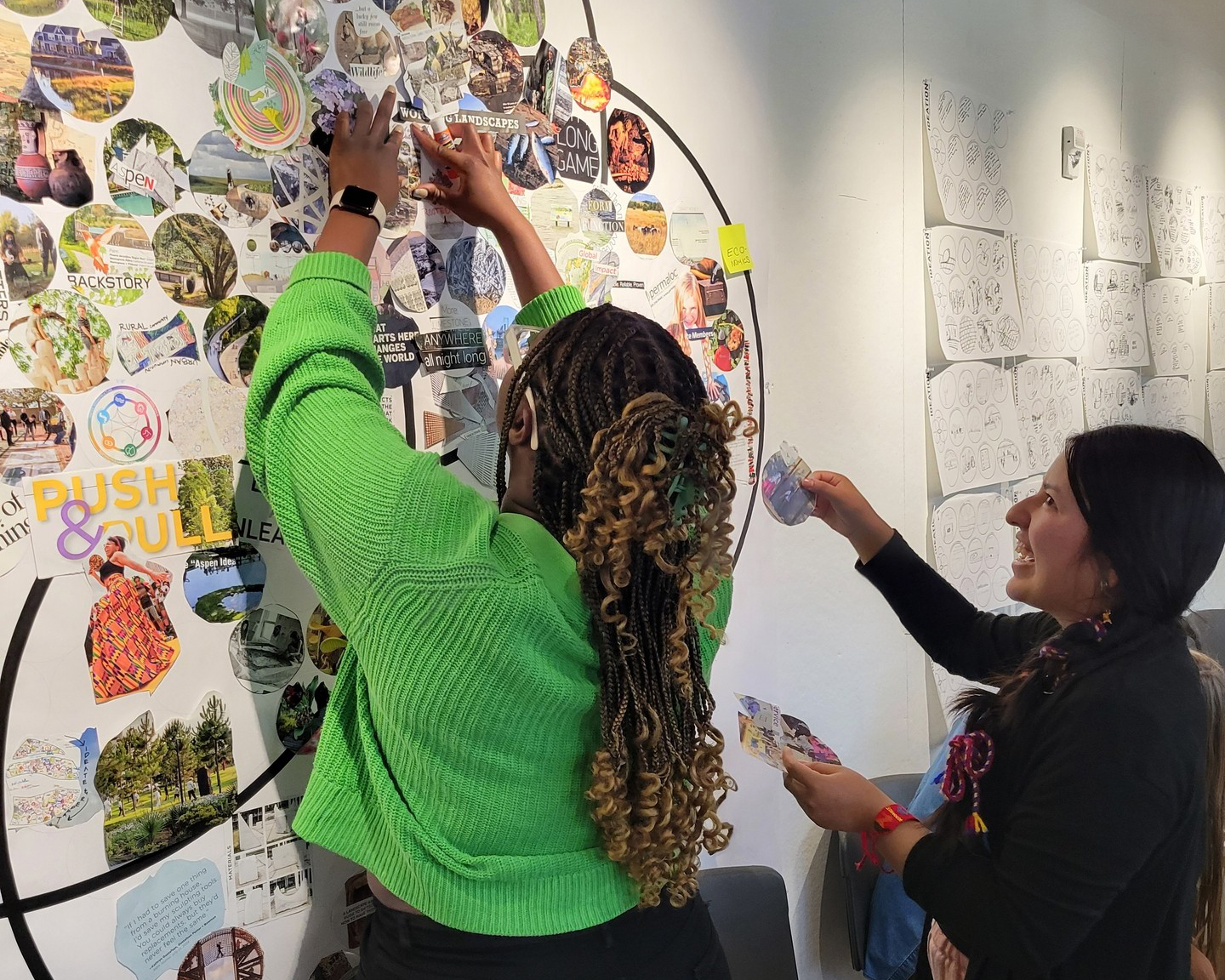DW employee-owners in the Aspen studio pin up images on a wall.