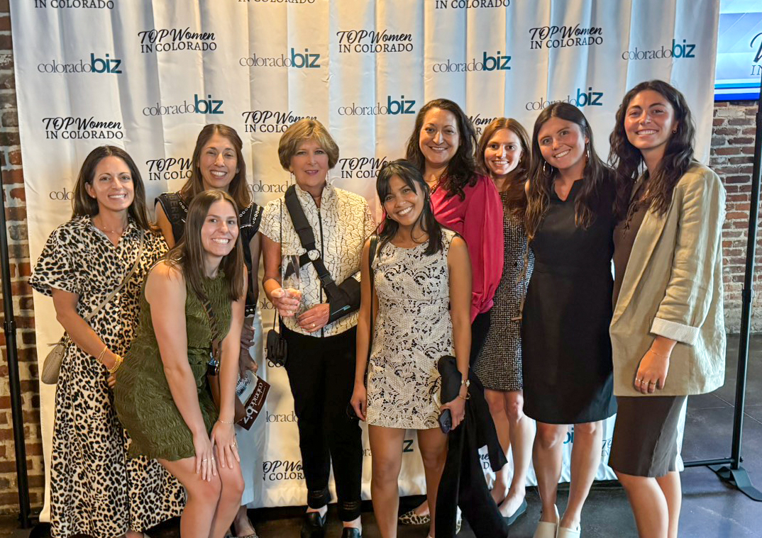 Design Workshop CEO, Becky Zimmermann (center) poses for a photo with her award alongside other women from Design Workshop.