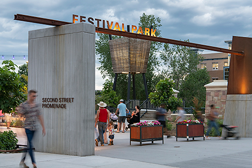 Well-designed entrance to a park, with activity and visual appeal.