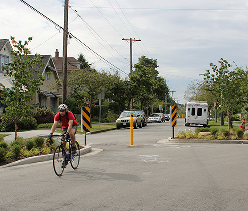 Bicyclist riding on road with dedicated bike lane